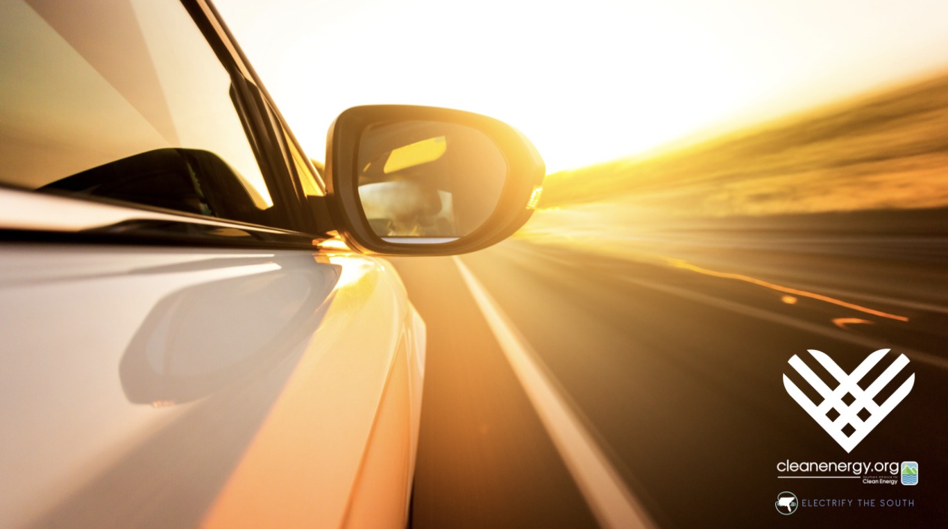 car driving toward sunlight